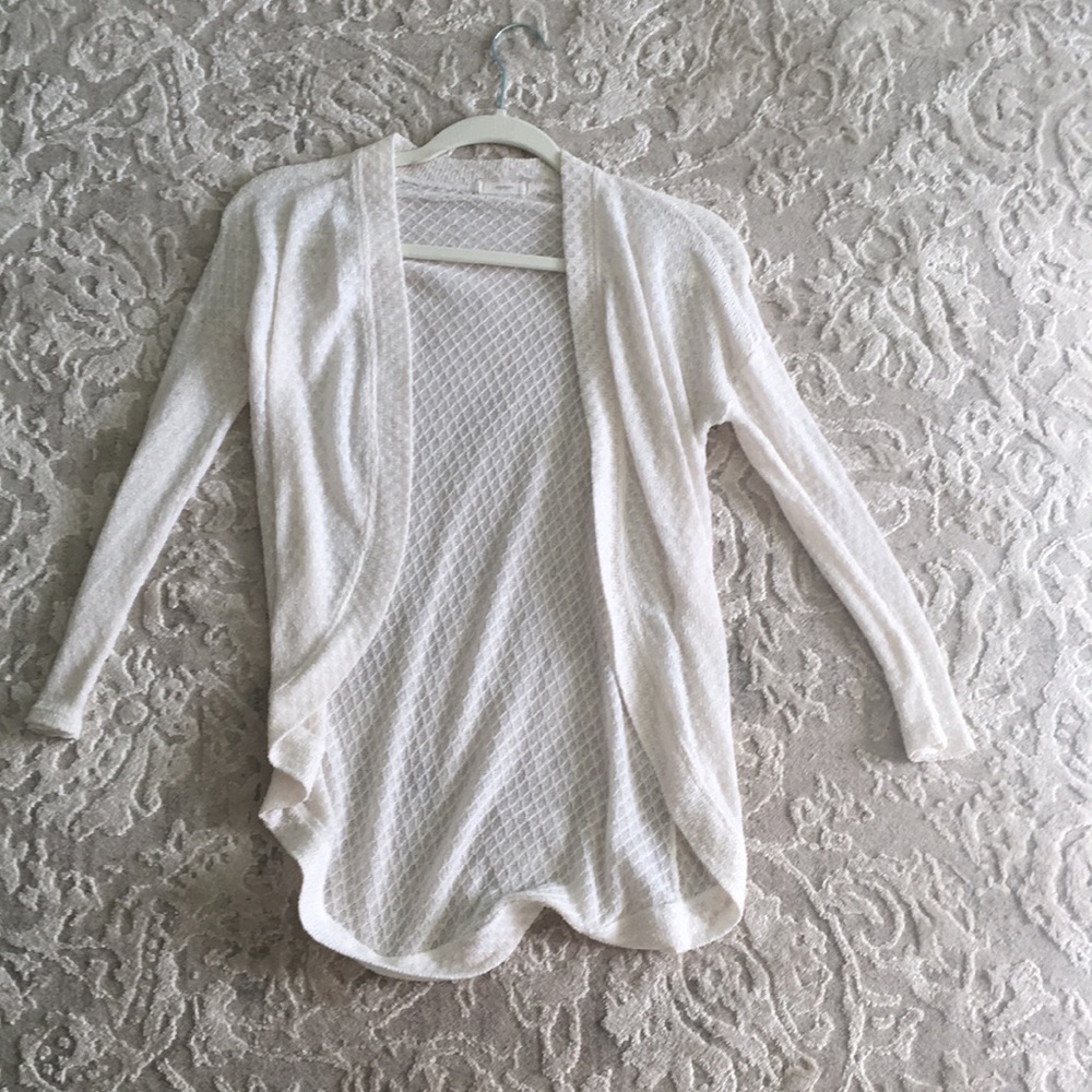 Cream colored cardigan with knitted texture